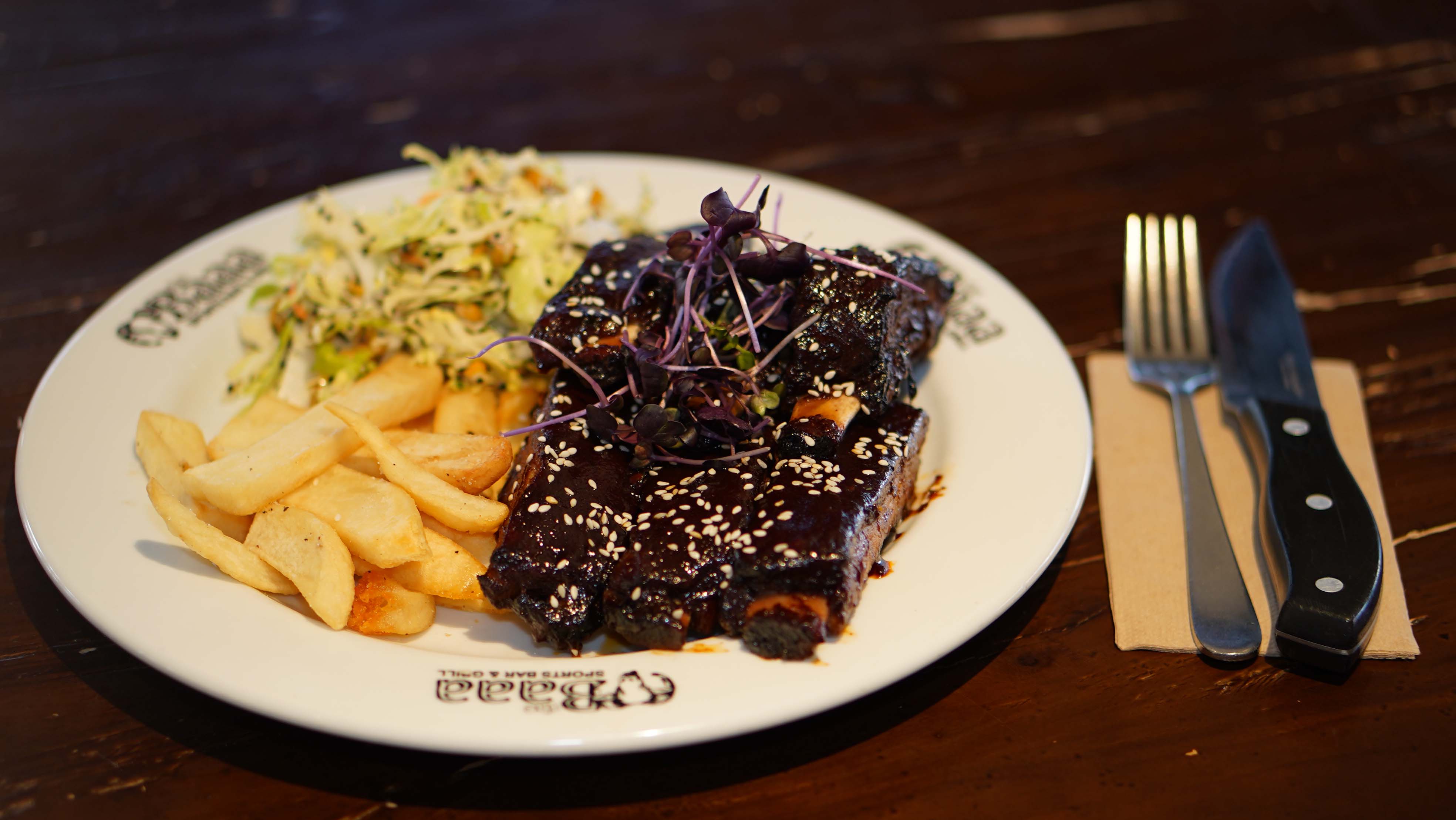 Glazed ribs served with chips and slaw